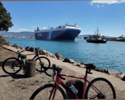 Athalie and Penny cycled to Port Kembla and stopped at the inner harbour to watch a departing car carrier.